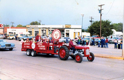 Pulling an AXPOW float with his tractor in a local parade.