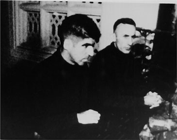 POWs Stratton and Mulligan at the Nativity creche in St. Joseph's Cathedral, Christmas 1967